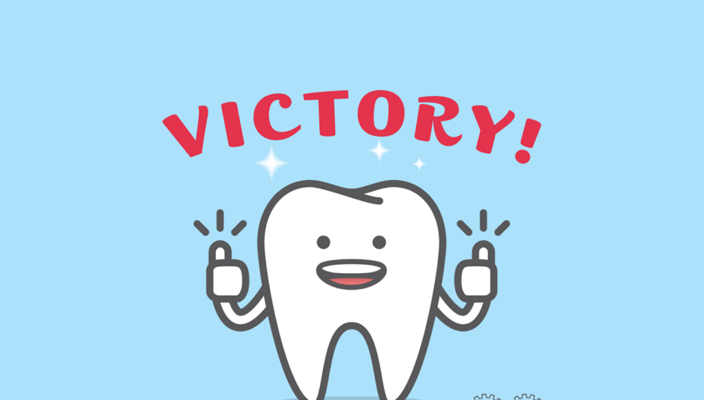 A cartoon tooth with the word "victory" above