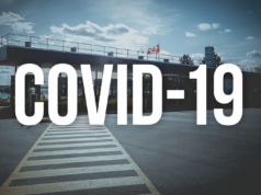 Audits de vaccination contre la COVID-19 : FAQ Image of border crossing with the words "COVID-19"