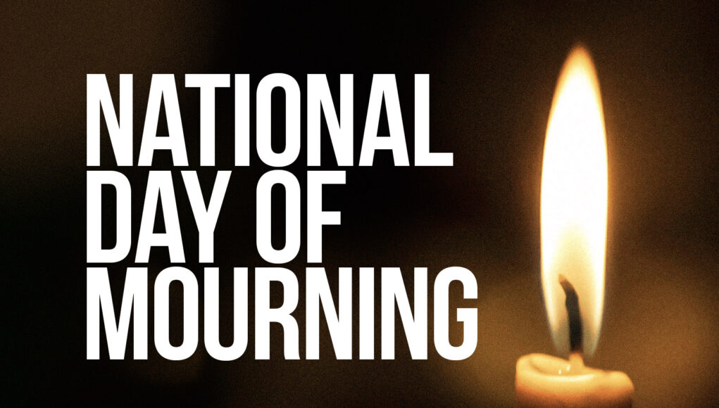 photo of candle with the words 'national day of mourning'