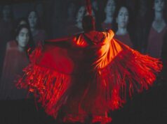 La Journée nationale des peuples autochtones marque un tournant pour le Canada image of an Indigenous dancer wearing a red dress