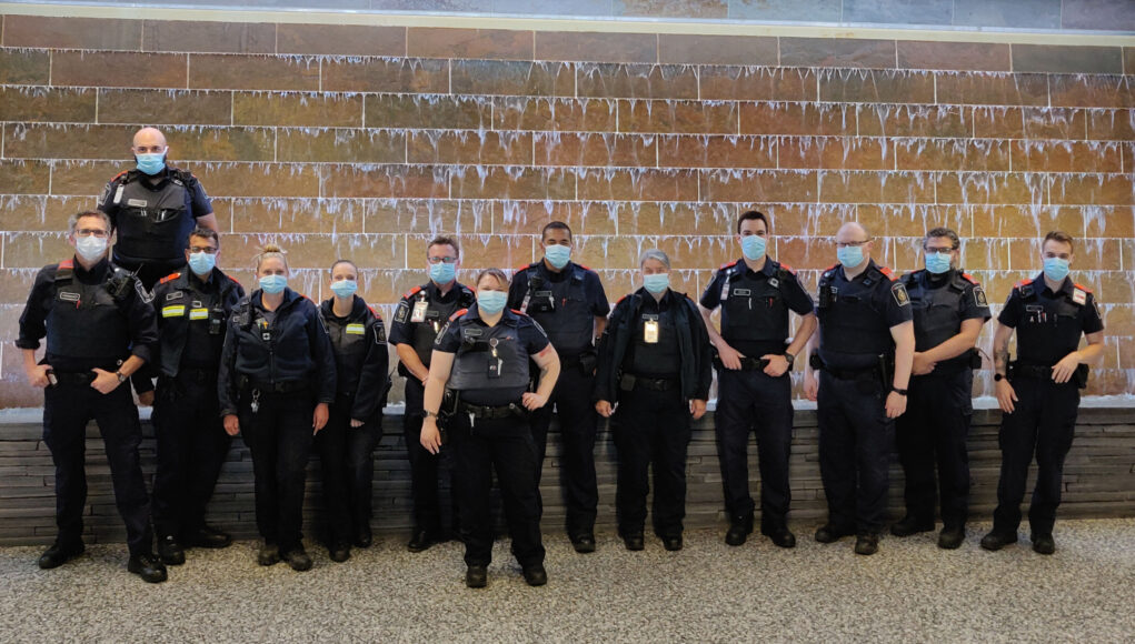 Calgary Airport Border Officers wearing orange epaulets in solidarity