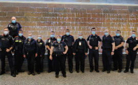 Calgary Airport Border Officers wearing orange epaulets in solidarity