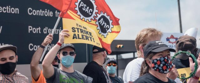 CIU members rallying with a sign that says "I'm on strike alert"